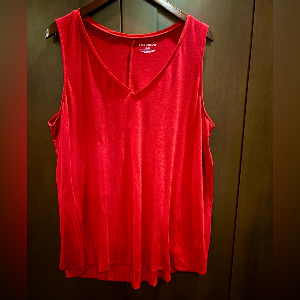 Knit long tank with fun pleated lightweight back detail.